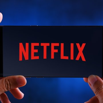 vpn services purevpn unlock netflix streaming services hands holding smartphone with netflix on